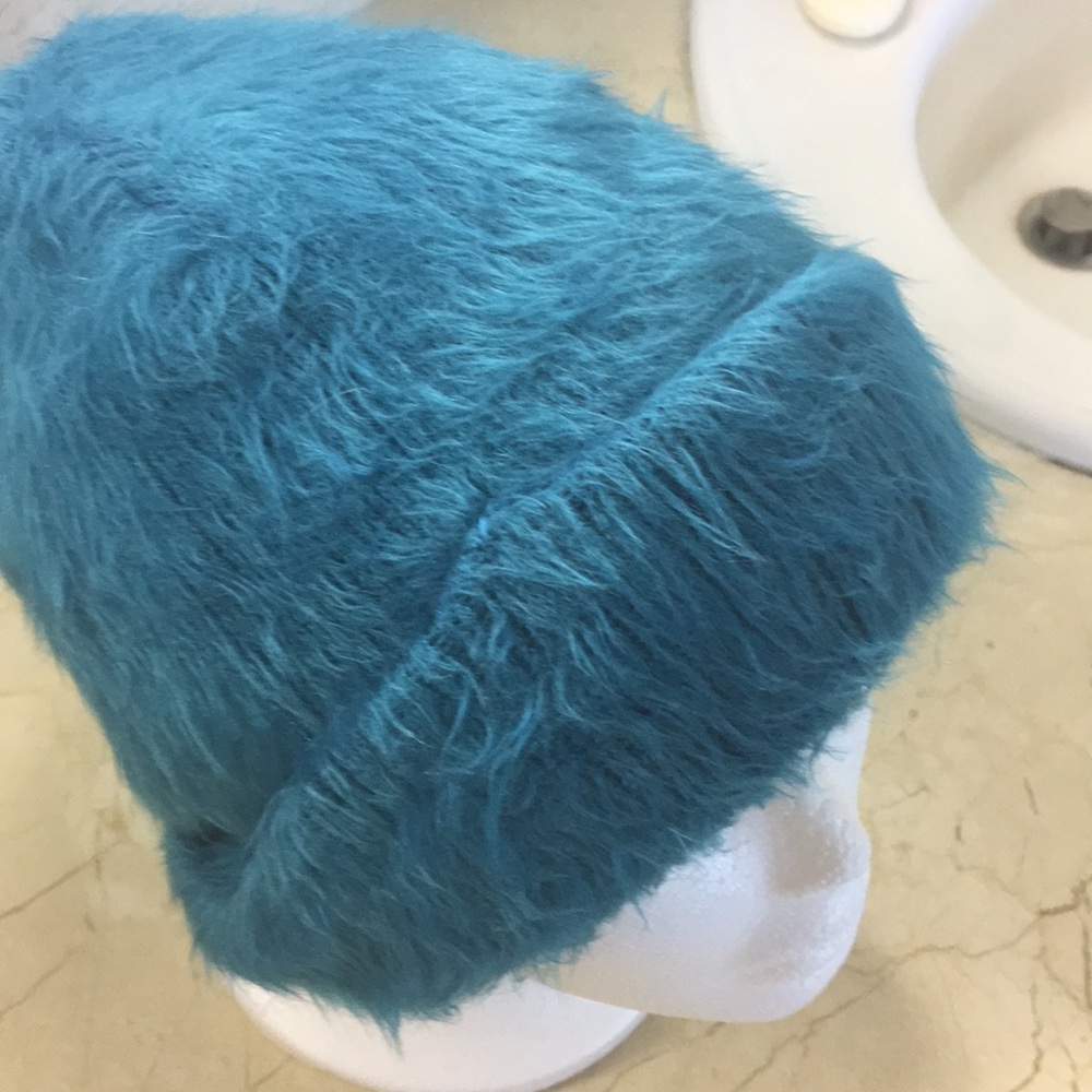 Turquoise furry skull cap